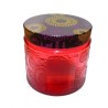 empty red  glas candle jar